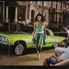 untitled (woman in a green dress in front of a green car)