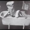 untitled (woman in bathtub with a paper bag over her head)