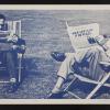 Untitled (men in lawn chairs with newspapers)