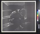 untitled (figure sitting on stairs with his head buried in his crossed arms)